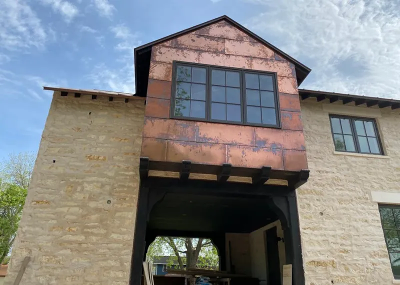 Copper metal panel facade on a stone building for Metal Roof Coating in Monroe